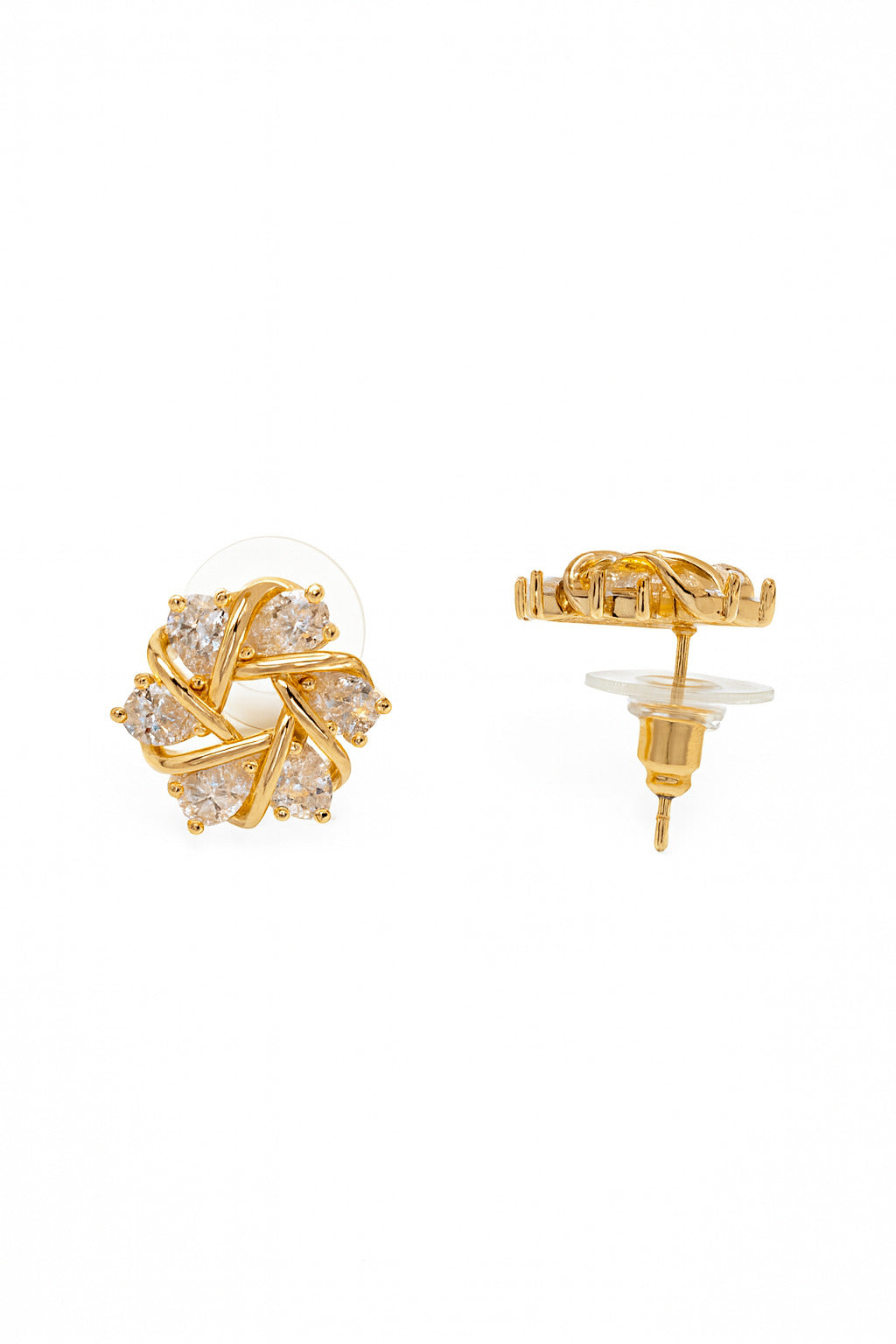 Gold earrings with clear gemstones on a white background