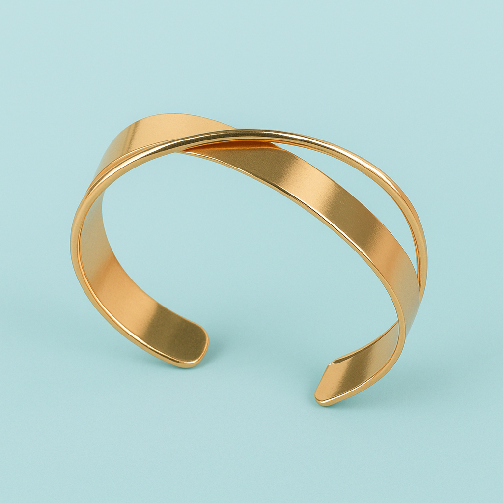 Gold bracelet on a light blue background