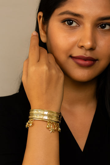 Gold Engraved Bangles with Hanging Charms