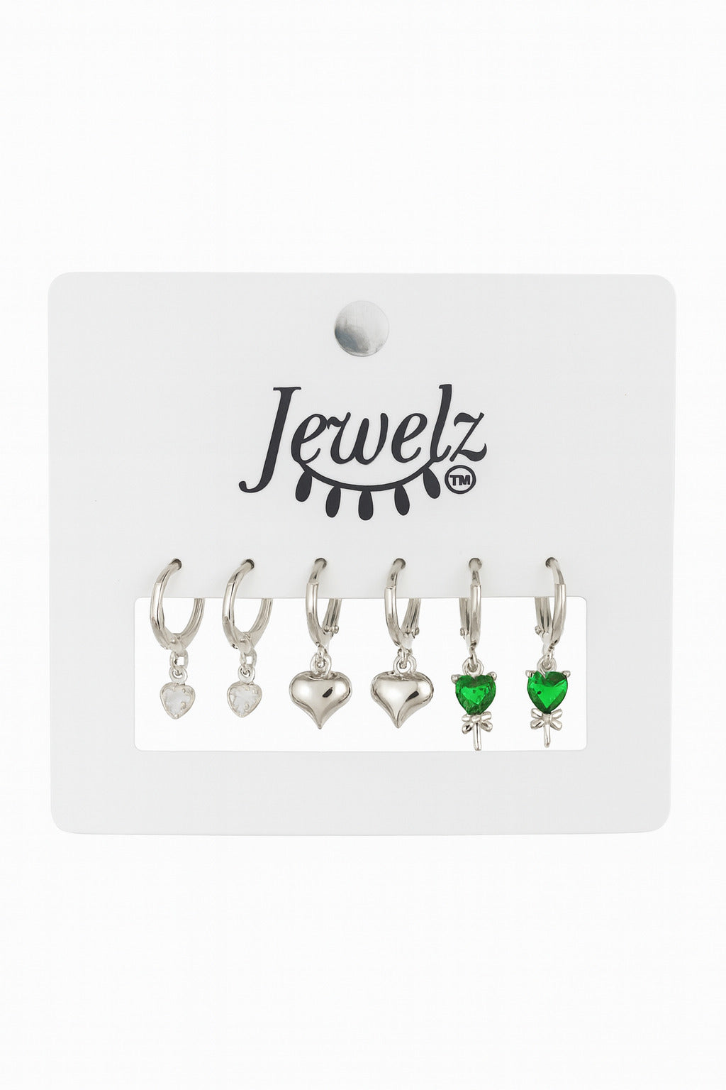 Set of heart-shaped earrings with a green gemstone on a 'Jewelz' branded card.