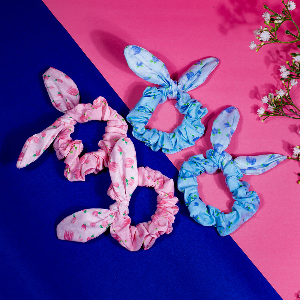 A set of four cotton rubber bands for women and girls, displayed in pink and blue colors with floral patterns.
