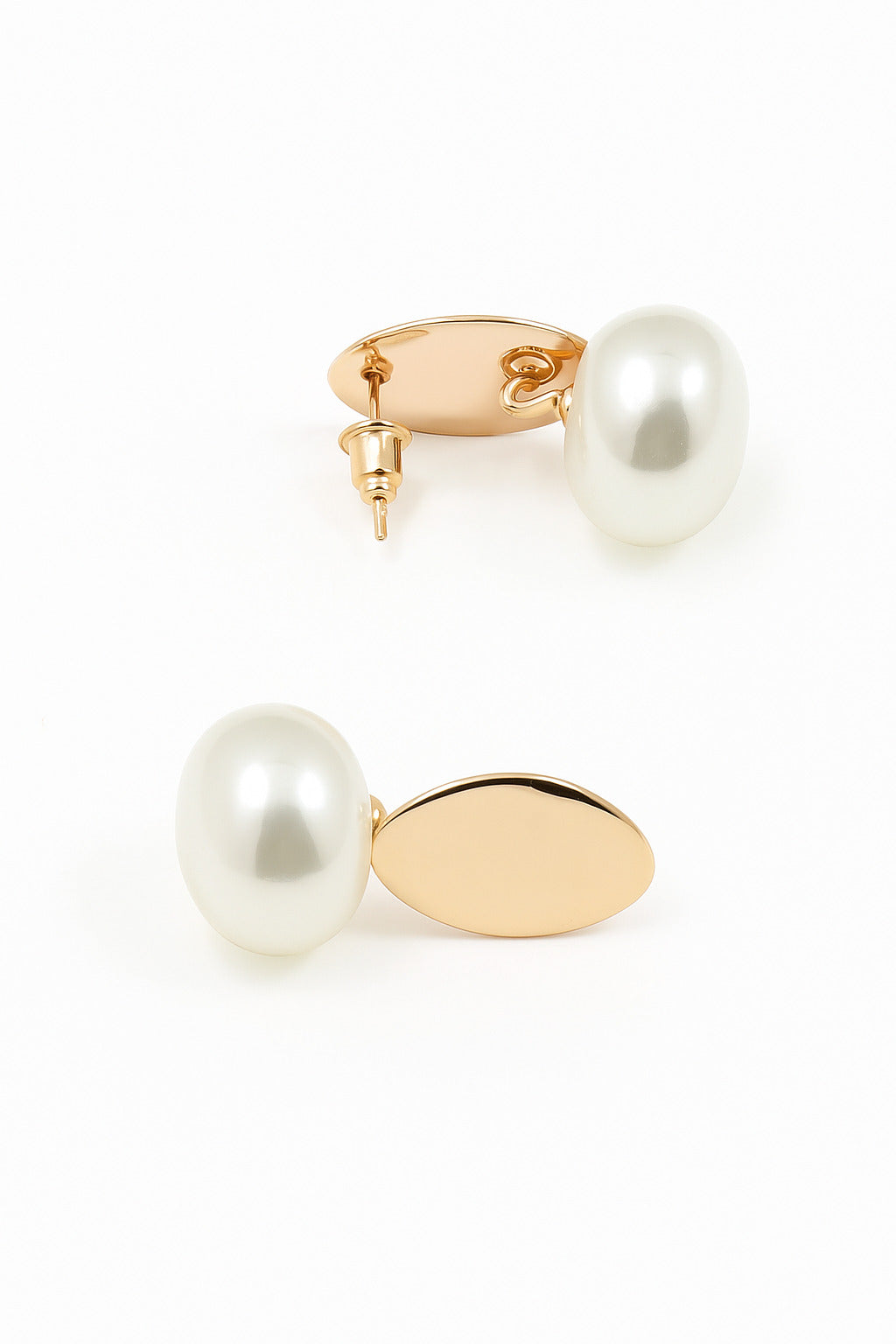 Pearl earrings with gold posts on a white background