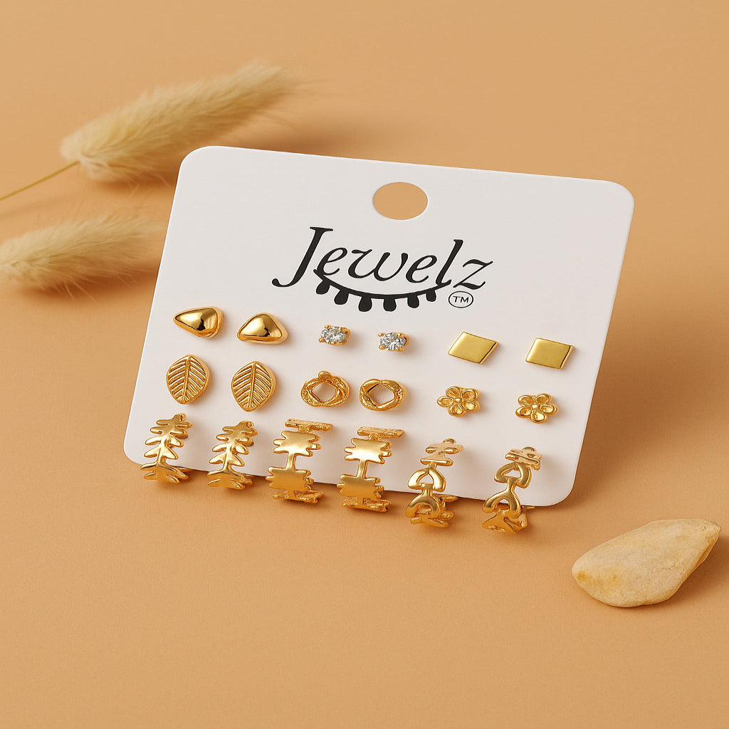 Set of gold earrings on a 'Jewelz' branded card with decorative elements on a beige background