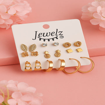 Set of gold earrings on a 'Jewelz' branded card with pink floral background