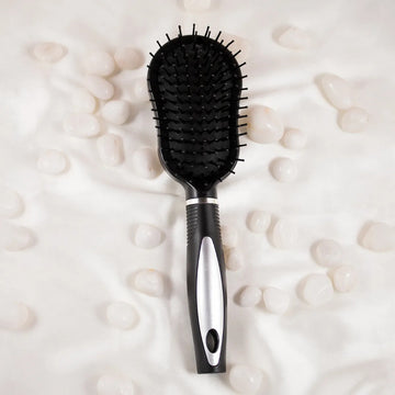 A black plastic hair comb with ergonomic design, featuring a comfortable grip and rounded edges.