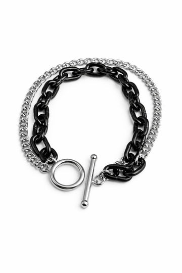 Black and silver chain bracelet on a white background