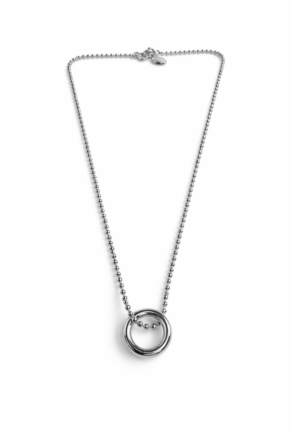 Silver necklace with a small round pendant on a white background
