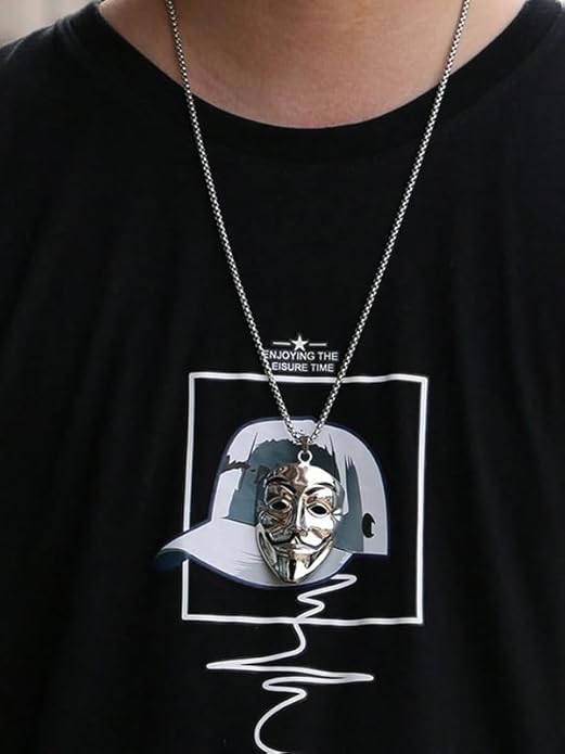 Person wearing a necklace with a pendant, black t-shirt with graphic design in the background