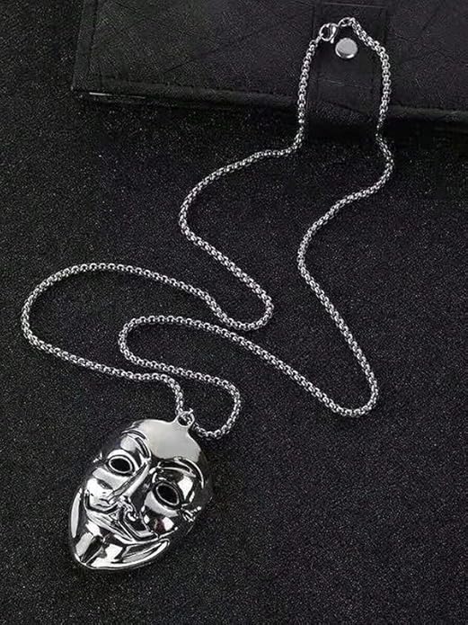 Silver mask pendant necklace on a black background