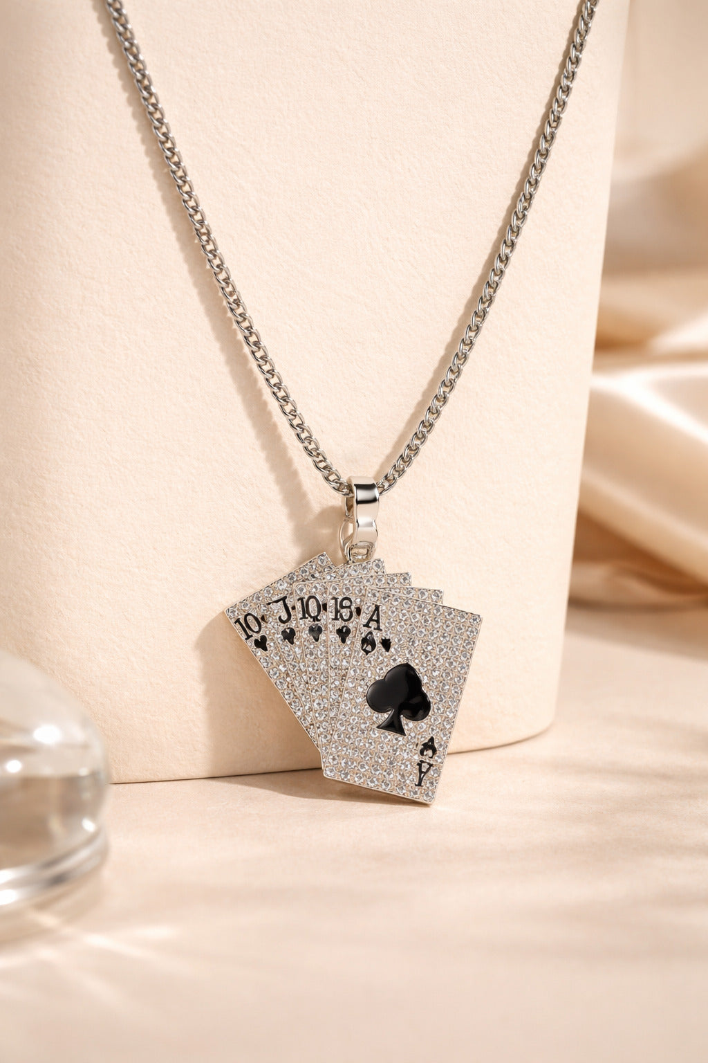Necklace with a card-shaped pendant on a beige background