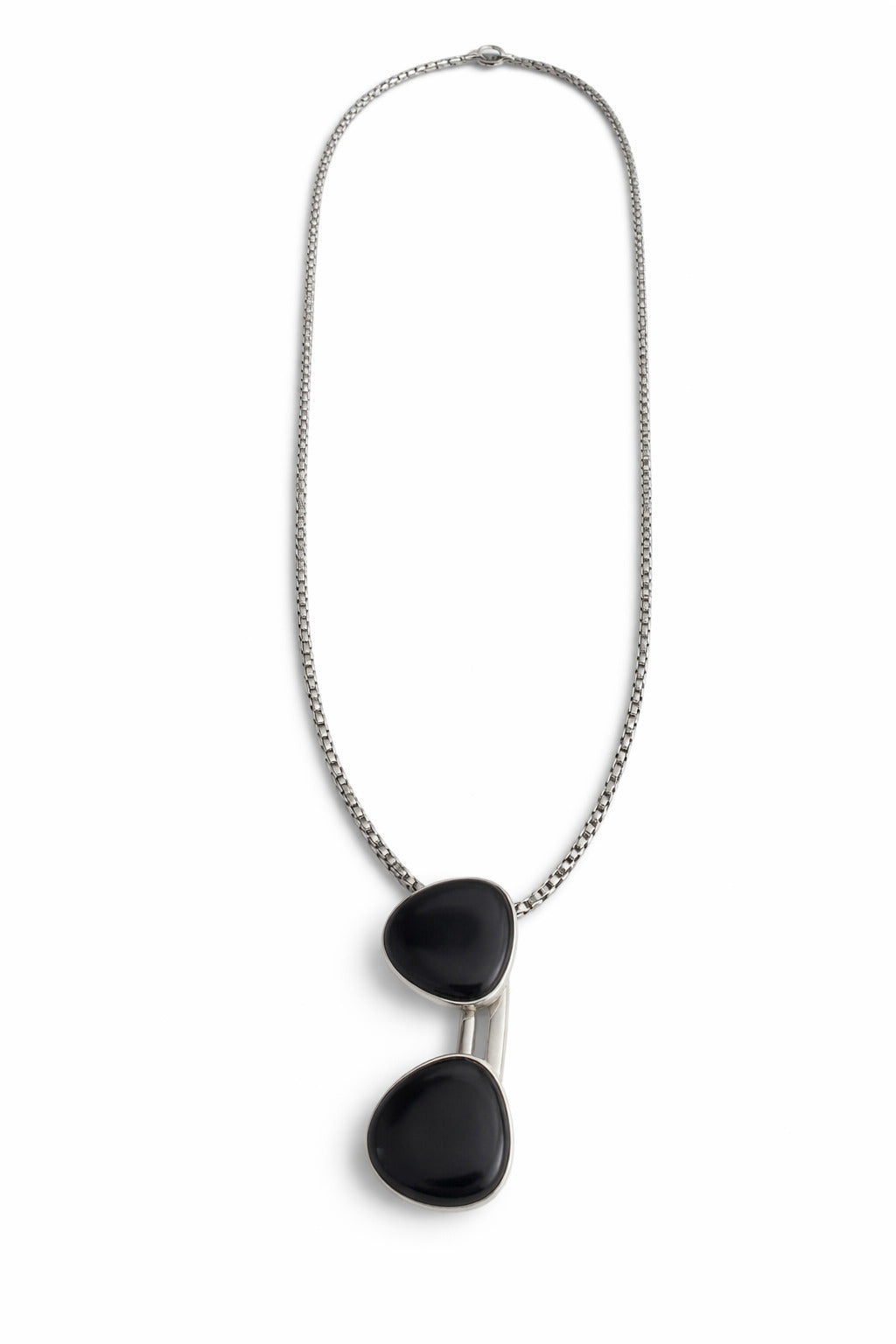 Necklace with black pendant on a white background