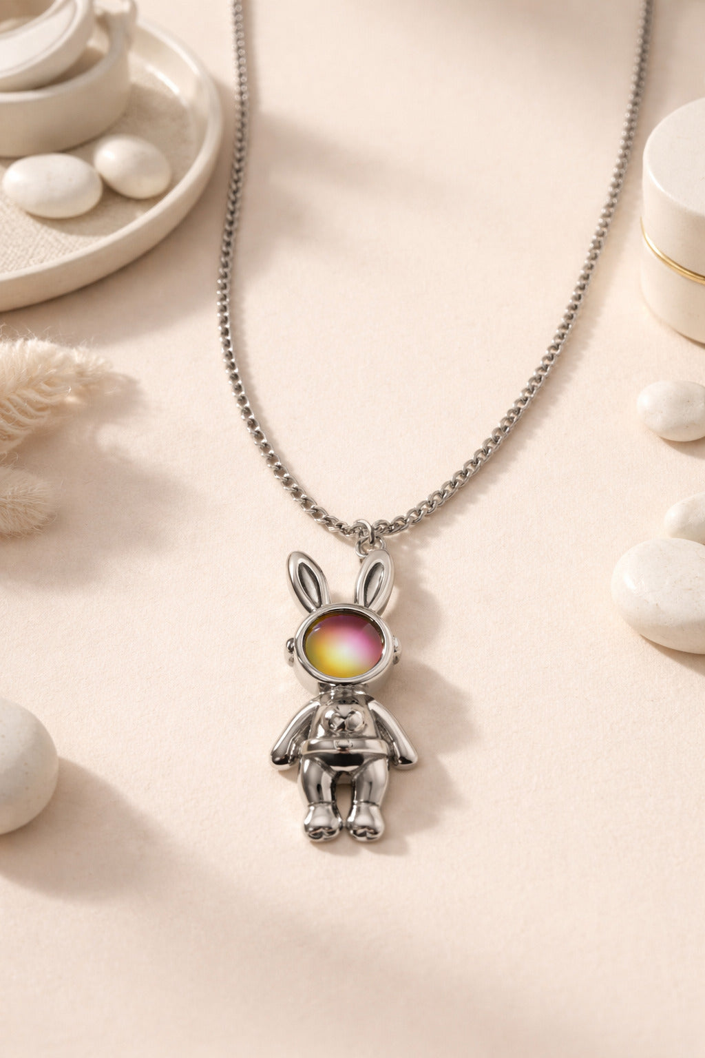 Necklace with a bunny pendant on a light background