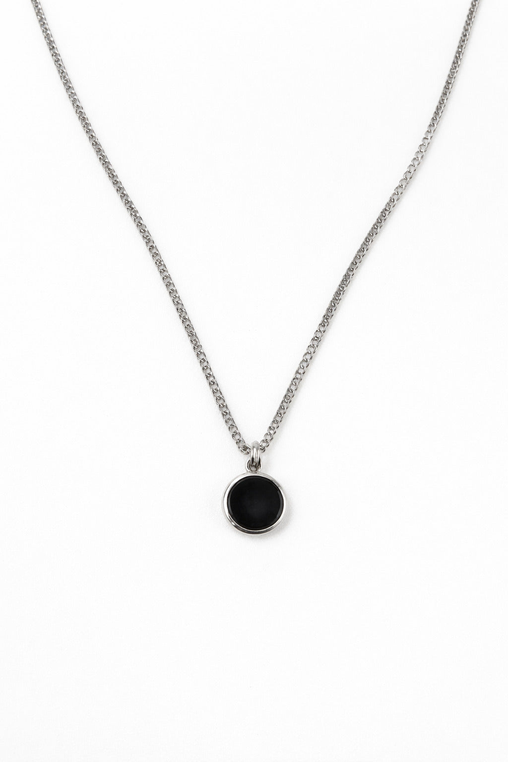 Necklace with a black pendant on a white background