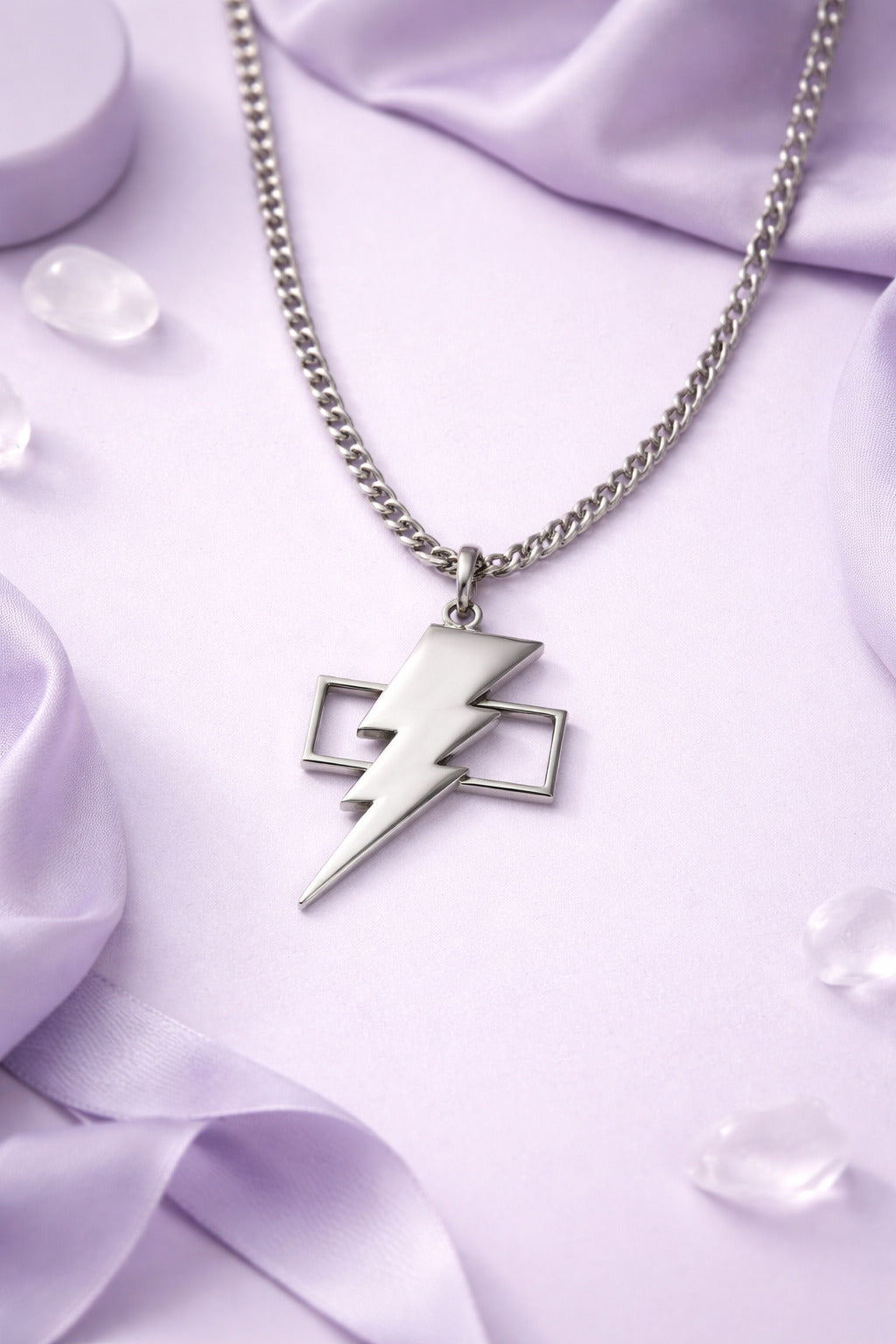 Necklace with a lightning bolt pendant on a purple fabric background