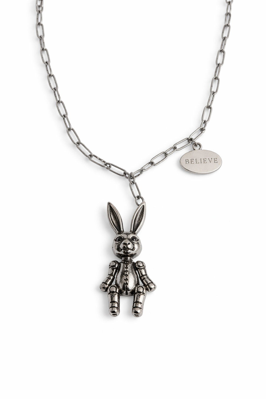 Silver bunny pendant necklace with 'BELIEVE' tag on a white background