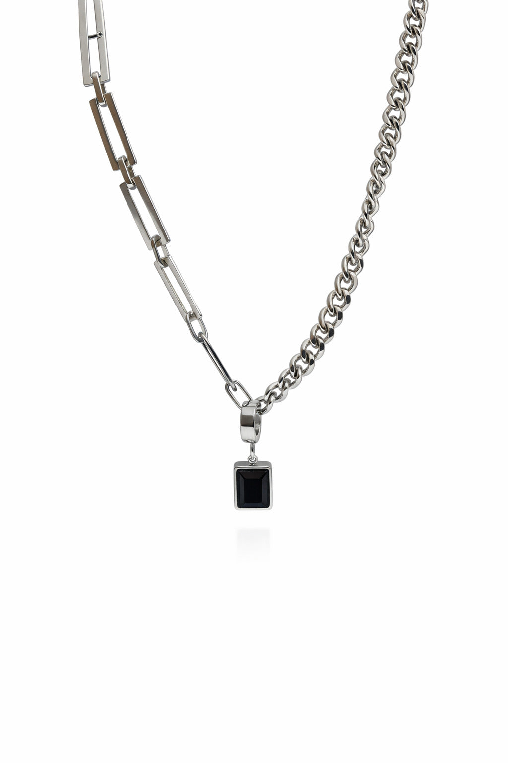 Double-layered chain necklace with a black pendant on a white background