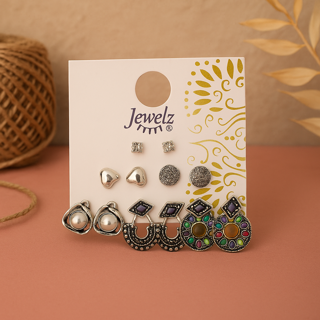 Set of earrings on a 'Jewelz' branded card with a decorative background