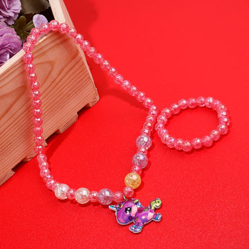 Pink beaded necklace with a small purple charm on a red background