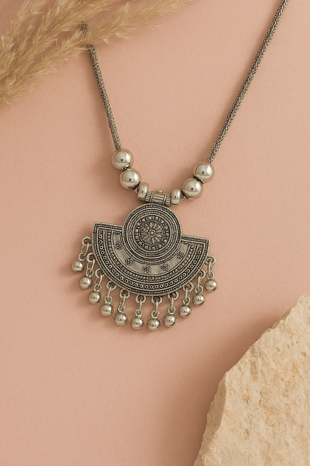Decorative necklace with pendant on a beige background