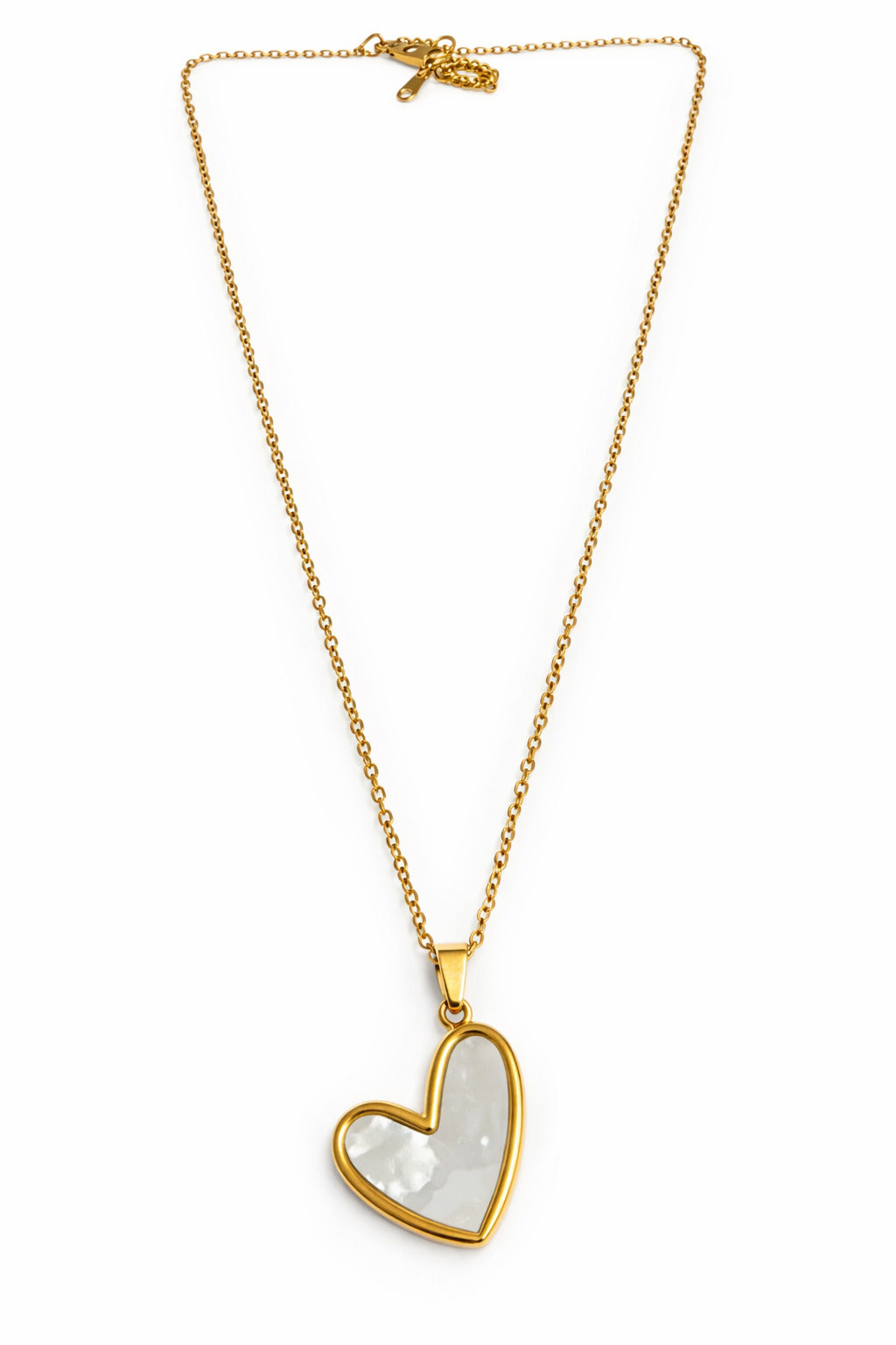 Gold necklace with a heart-shaped pendant on a white background