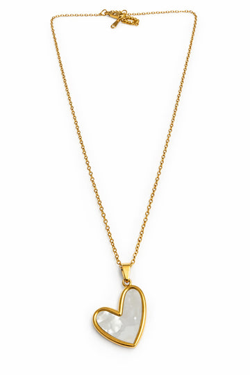 Gold necklace with a heart-shaped pendant on a white background