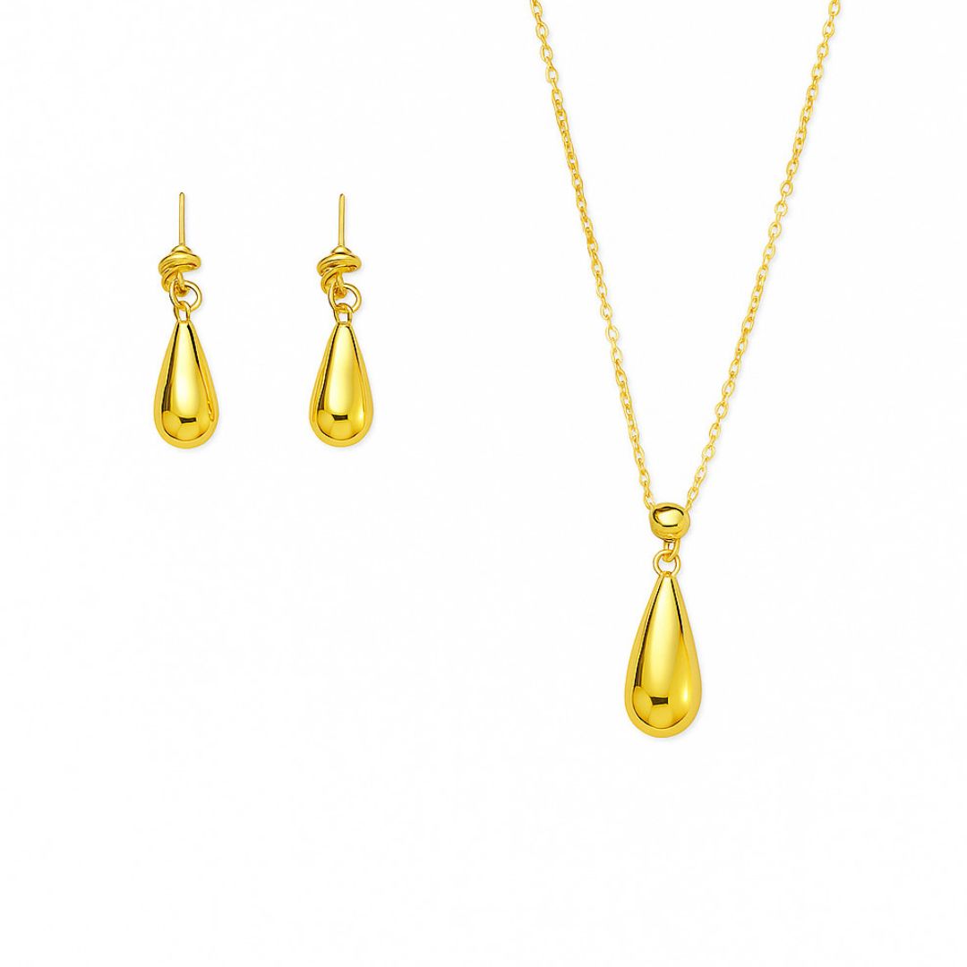 Gold teardrop necklace and earrings on a white background