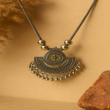 Ornate necklace with beads on a beige background