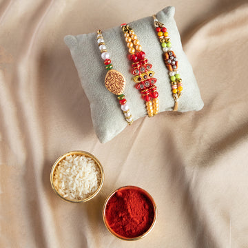 Traditional Pearl, Stone & Carved Motif Rakhi Trio Set – Festive Rakshabandhan Gift