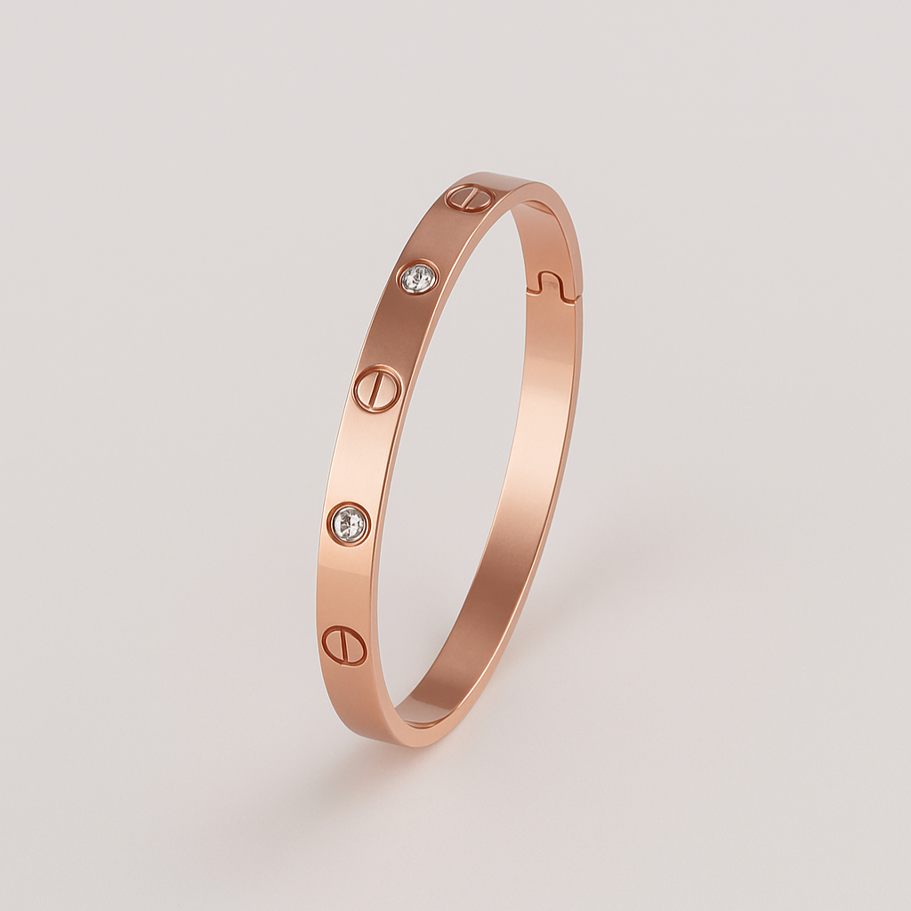 Rose gold bracelet with diamond accents on a light gray background