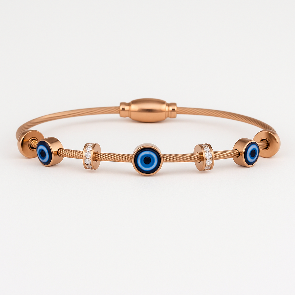 Rose gold bracelet with blue evil eye charms on a white background