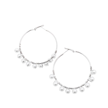 A pair of silver-plated alloy hoop earrings with white pearl accents, designed in a classic Bali-style.