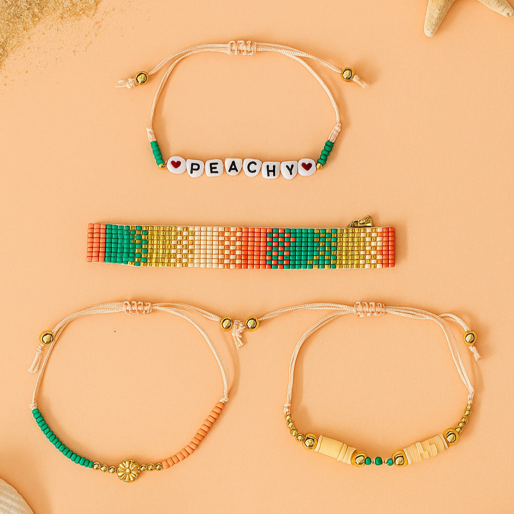 Three beaded bracelets on a peach background
