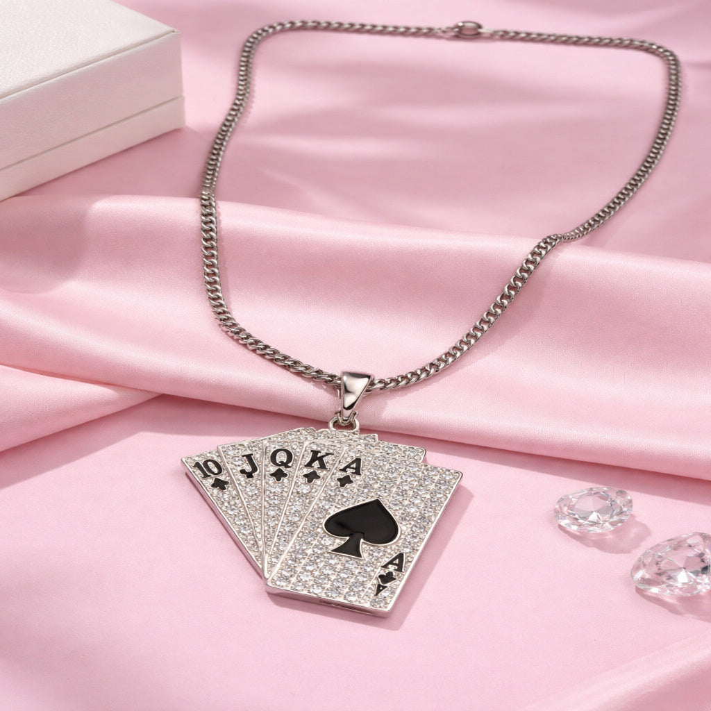 Necklace with a card pendant on a pink fabric background