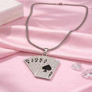Necklace with a card pendant on a pink fabric background