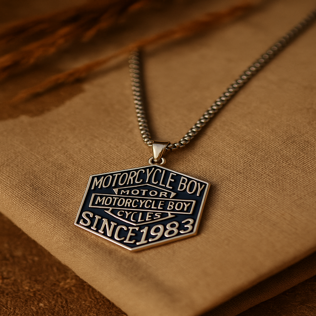 Necklace with a 'Motorcycle Boy Cycles' pendant on a brown fabric background