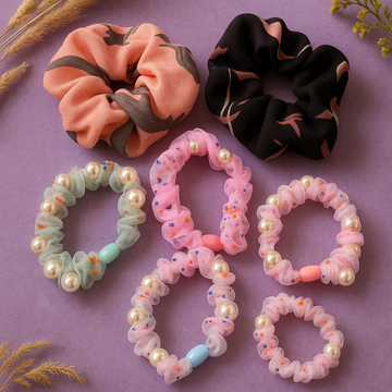 Set of colorful scrunchies on a purple background