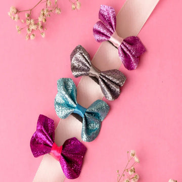 Trendy Neon Colored Bow Hair Clips On A Pink Flower Background Surface