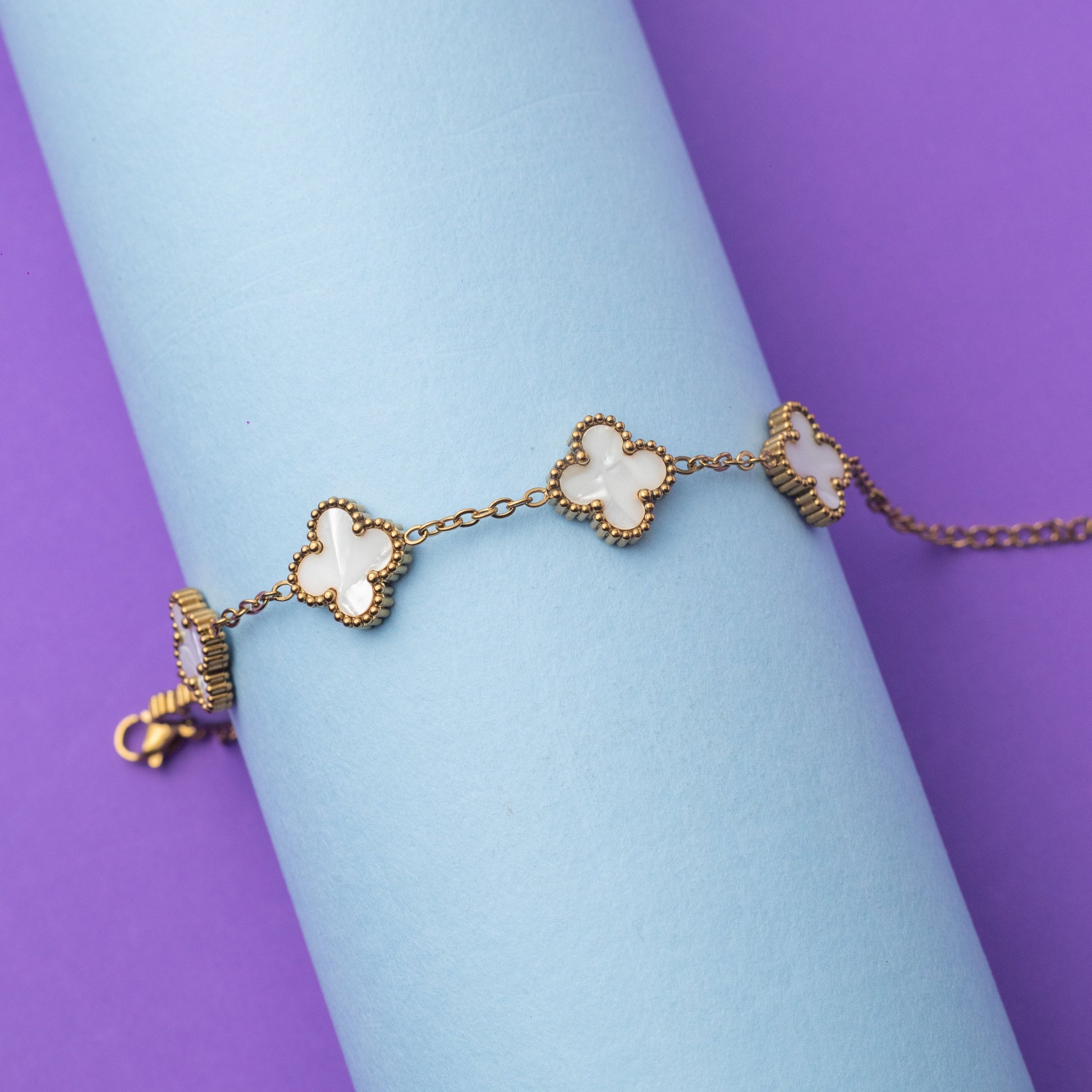 Bracelet with floral designs on a light blue and purple background