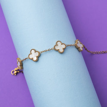 Bracelet with floral designs on a light blue and purple background