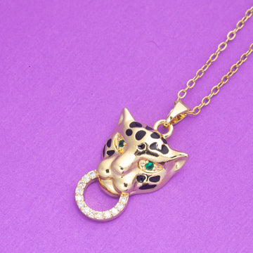 Gold panther necklace with gemstones on a purple background